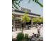 Halcyon community view featuring outdoor seating and shops with green space in foreground at 636 Silva St, Cumming, GA 30040