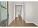 Inviting entryway featuring hardwood floors, neutral walls, and a view of the open-concept living space at 636 Silva St, Cumming, GA 30040