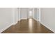 Hallway featuring hardwood flooring, neutral walls, and natural light at 636 Silva St, Cumming, GA 30040