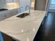 This gourmet kitchen boasts a large island, stainless steel sink, and modern countertops at 636 Silva St, Cumming, GA 30040