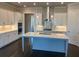 This spacious kitchen features sleek countertops, a central island, and ample cabinet storage at 636 Silva St, Cumming, GA 30040