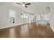Open floor plan showcasing the living room and kitchen with white cabinets at 636 Silva St, Cumming, GA 30040