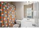 Bright bathroom featuring a modern vanity, decorative shower curtain, and neutral wall color at 1186 Arbor Park Sw Ln, Atlanta, GA 30311