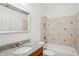 Well-lit bathroom featuring a granite vanity, a tiled shower and tub, and a large mirror for added space at 1186 Arbor Park Sw Ln, Atlanta, GA 30311
