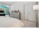 Bedroom showcasing a dresser, doorway and sitting area with teal accent wall at 1186 Arbor Park Sw Ln, Atlanta, GA 30311