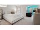 Comfortable bedroom with a plush bed, sitting area with teal accent wall, and modern decor at 1186 Arbor Park Sw Ln, Atlanta, GA 30311