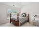 Bedroom featuring a four post bed and large window at 1186 Arbor Park Sw Ln, Atlanta, GA 30311