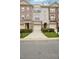 Charming townhomes with brick and stucco exteriors, featuring attached garages and inviting entrances at 1186 Arbor Park Sw Ln, Atlanta, GA 30311