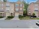 Beautiful brick townhome featuring a well-manicured lawn and attached garages at 1186 Arbor Park Sw Ln, Atlanta, GA 30311
