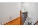 Upstairs hallway with hardwood floors, white walls, and a decorative railing overlooking the lower level at 1186 Arbor Park Sw Ln, Atlanta, GA 30311