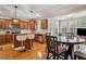 Charming kitchen with wooden cabinets, stainless steel appliances, and an adjacent dining area at 1186 Arbor Park Sw Ln, Atlanta, GA 30311