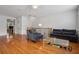 Cozy living room area with hardwood floors, stylish seating, and an open concept layout at 1186 Arbor Park Sw Ln, Atlanta, GA 30311