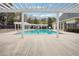 Beautiful community pool area with lounge chairs, shade structures, and lush landscaping at 1186 Arbor Park Sw Ln, Atlanta, GA 30311