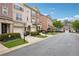 Street view of townhome community with sidewalks and manicured landscaping at 1186 Arbor Park Sw Ln, Atlanta, GA 30311