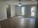 Bright living room with large windows, new floors, and neutral paint, a wonderful living space at 2039 Corners Cir, Lithonia, GA 30058