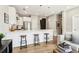 Open-concept kitchen featuring a breakfast bar with modern stools and stainless steel appliances at 22 Airline Ne St # 204, Atlanta, GA 30312