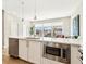 Modern kitchen island with stainless steel appliances and white countertop at 22 Airline Ne St # 204, Atlanta, GA 30312