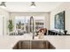 Modern kitchen countertop with stainless steel faucet and stainless appliances at 22 Airline Ne St # 204, Atlanta, GA 30312