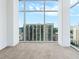 Bedroom with floor to ceiling windows boasting an incredible skyline view at 250 Pharr Ne Rd # 2101, Atlanta, GA 30305