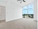 Bright empty bedroom with floor-to-ceiling windows providing natural light and city views at 250 Pharr Ne Rd # 2101, Atlanta, GA 30305