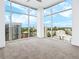 Bedroom boasting expansive windows with panoramic city views at 250 Pharr Ne Rd # 2101, Atlanta, GA 30305