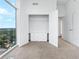 Bright bedroom features a closet with built-in drawers and a large window with beautiful neighborhood views at 250 Pharr Ne Rd # 2101, Atlanta, GA 30305