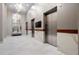 Hallway with modern elevators, marble accents, contemporary lighting, and sleek finishes at 250 Pharr Ne Rd # 2101, Atlanta, GA 30305