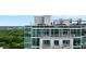 Close exterior view of the condominium featuring balconies and window views at 250 Pharr Ne Rd # 2101, Atlanta, GA 30305