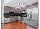 Well-equipped kitchen boasts stainless steel appliances, sleek cabinetry, and mosaic tile backsplash at 250 Pharr Ne Rd # 2101, Atlanta, GA 30305