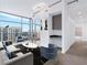 Bright living room with floor-to-ceiling windows and city views at 250 Pharr Ne Rd # 2101, Atlanta, GA 30305