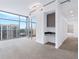 Sunlit living room with neutral carpeting and large windows overlooking the cityscape at 250 Pharr Ne Rd # 2101, Atlanta, GA 30305