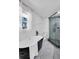 Bright bathroom featuring a modern tub and sleek shower with large window for a view of the outdoors at 2615 Holly Ln, Marietta, GA 30062