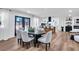 Bright dining room with a view of the kitchen, featuring modern light gray chairs and black accents at 2615 Holly Ln, Marietta, GA 30062