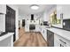 Modern kitchen with stainless steel appliances, black marble accents, and an open floor plan at 2615 Holly Ln, Marietta, GA 30062