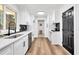 Bright kitchen featuring white cabinets and countertops accented by modern black fixtures and backsplash at 2615 Holly Ln, Marietta, GA 30062