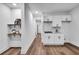 Small white kitchenette with marble backsplash and open shelving at 2615 Holly Ln, Marietta, GA 30062