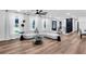Open-concept living area with modern decor, featuring hardwood floors, white walls, and ample natural light at 2615 Holly Ln, Marietta, GA 30062