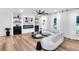 Bright living room with white sofa, modern fireplace with storage, and plenty of natural light at 2615 Holly Ln, Marietta, GA 30062