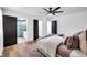 Relaxing main bedroom with a ceiling fan and view to an enclosed glass shower and well-lit interior bathroom at 2615 Holly Ln, Marietta, GA 30062