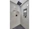 Walk in shower with gray tile and a black rainfall shower head at 2615 Holly Ln, Marietta, GA 30062