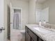 Bathroom with granite countertop, modern fixtures, and a separate shower and tub at 4720 Gablestone Xing, Hoschton, GA 30548