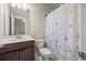Bathroom featuring a vanity with a single sink and a butterfly-themed shower curtain, creating a calming and inviting space at 4720 Gablestone Xing, Hoschton, GA 30548