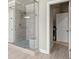 Modern bathroom featuring glass enclosed shower and contemporary fixtures at 4720 Gablestone Xing, Hoschton, GA 30548
