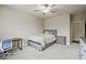 A cozy bedroom with a comfortable bed, a study desk, and plush carpet for relaxation and productivity at 4720 Gablestone Xing, Hoschton, GA 30548