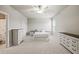 Spacious bedroom with plush carpet, two dressers, and an ensuite bathroom for comfort and convenience at 4720 Gablestone Xing, Hoschton, GA 30548