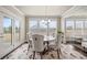 Cozy dining area featuring large windows and stylish furnishings at 4720 Gablestone Xing, Hoschton, GA 30548