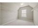 A clean empty room with neutral walls, carpet, and closet shelving at 4720 Gablestone Xing, Hoschton, GA 30548