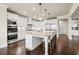 Bright kitchen with modern appliances, granite countertops, white cabinets, and island with seating at 4720 Gablestone Xing, Hoschton, GA 30548