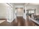 Bright and airy living area showcasing hardwood floors and an open floor plan at 4720 Gablestone Xing, Hoschton, GA 30548