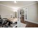Spacious office with desk, hardwood floors and glass French doors at 4720 Gablestone Xing, Hoschton, GA 30548